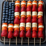 American Flag Fruit Kabobs Recipe with strawberries, bananas, blueberries, and melon on skewers