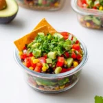 Cowboy caviar salad with avocado, black beans, corn, tomatoes, and tortilla chips