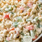 Creamy Greek yogurt macaroni salad with cucumbers, peppers, and fresh vegetables