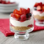 No-Bake Berry Yogurt Cheesecake layered with fresh strawberries, raspberries, and creamy yogurt filling