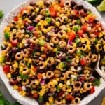 Simple cowboy caviar made with black beans, black-eyed peas, corn, peppers, and fresh herbs