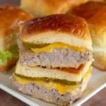 Juicy turkey burger sliders topped with melted cheese and pickles on soft buns